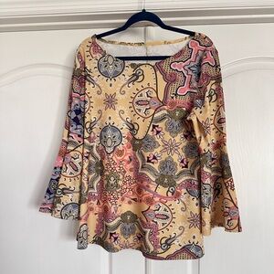 loose fitting tunic top with bell sleeves.